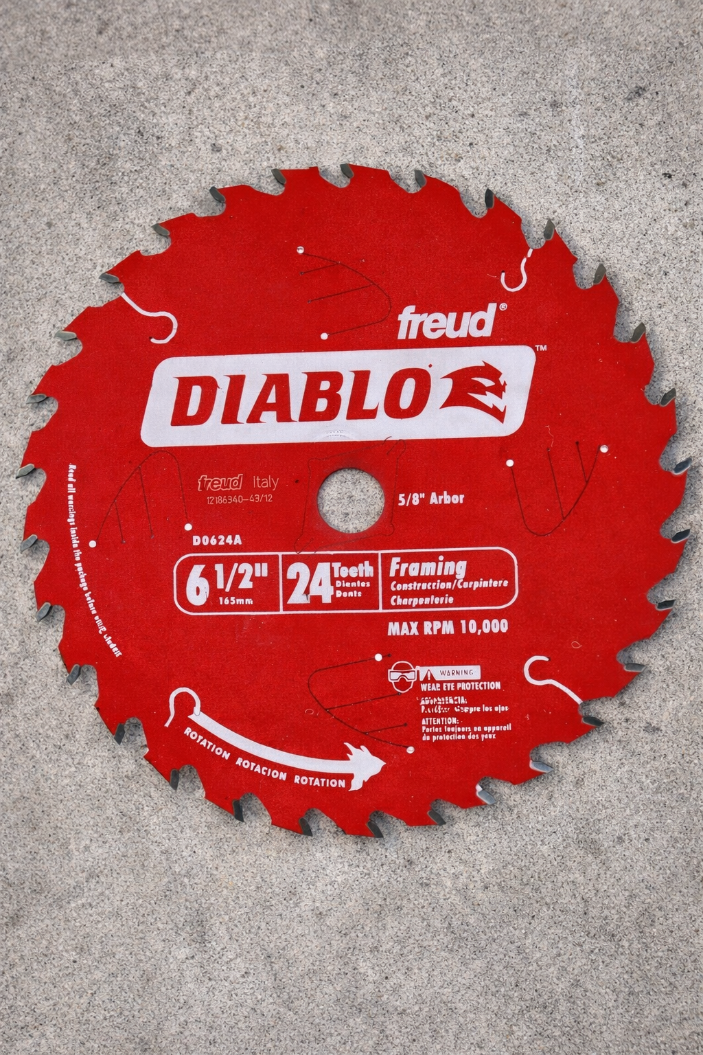 Red Diablo saw blade on a concrete surface